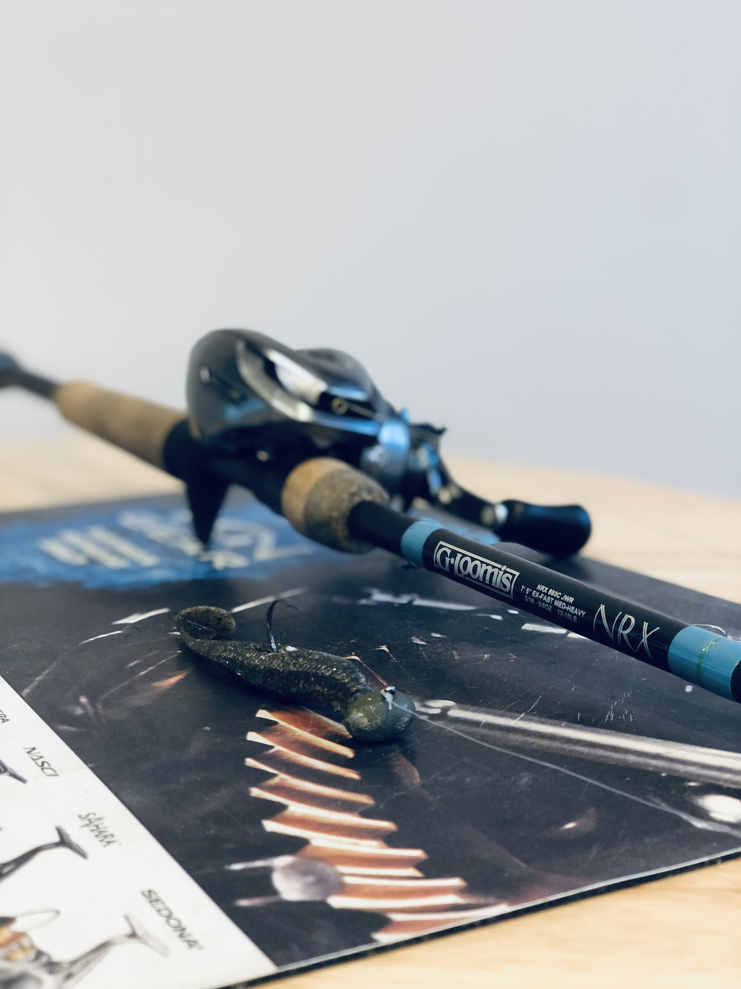 Shimano Metanium DC and G. Loomis NRX 893C Casting rod. Football Jig and paddletail swimbait rod and reel setup.